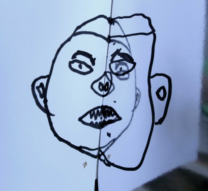 Dziecięcy rysunek przedstawiający głowę. 